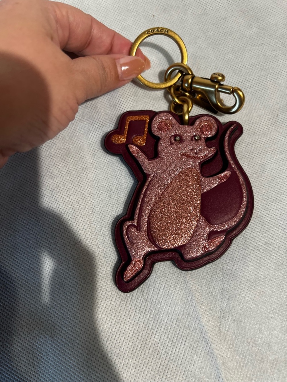COACH  Dancing Party Mouse Keychain in Burgundy and Rose Gold